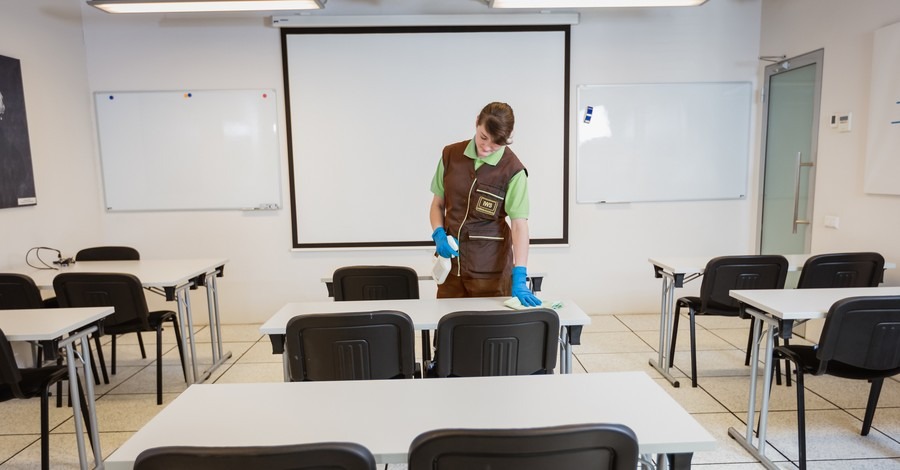 educational cleaning perth team disinfecting classroom desks